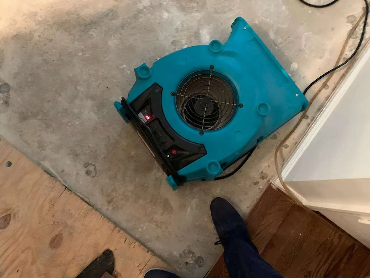 Air mover drying subfloor during Leak Detection & Repair in Lumberton